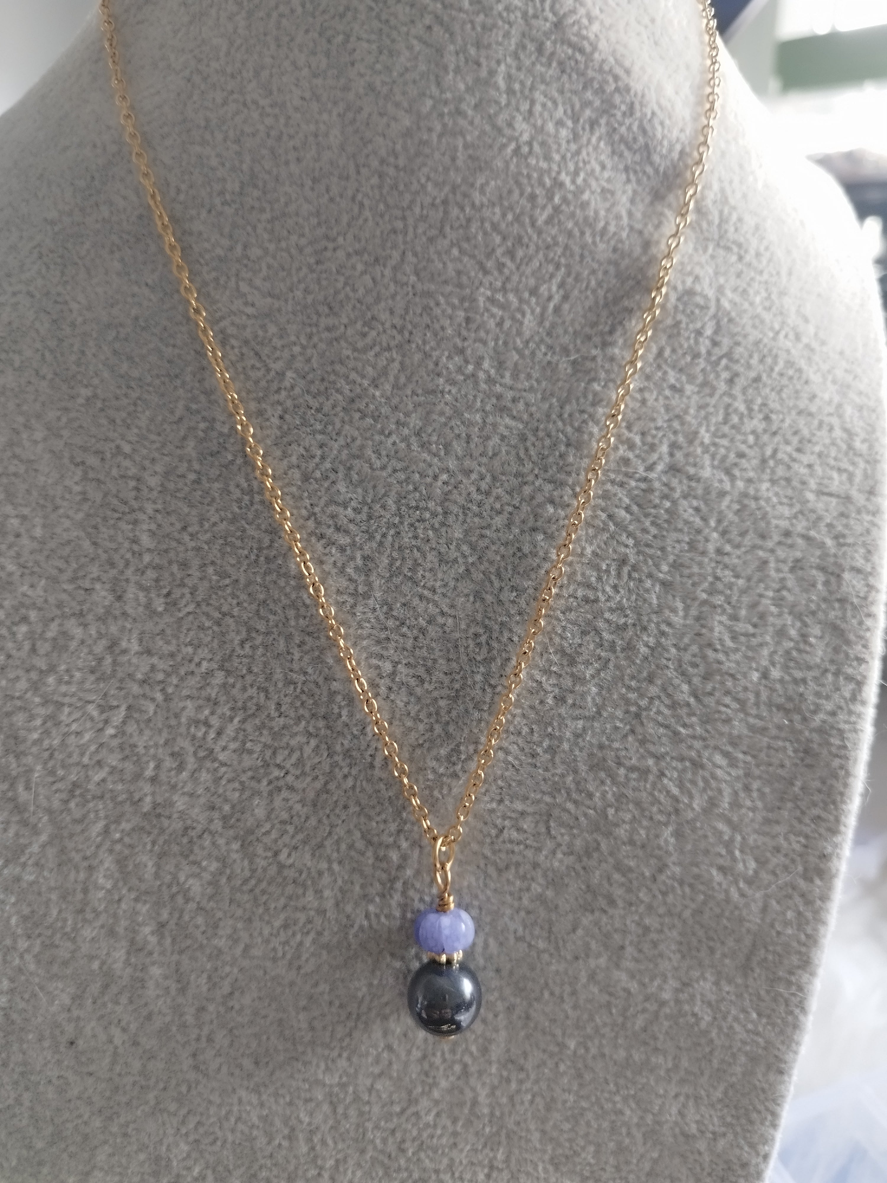 Collier Duo Hématite et Tanzanite - Ancrage et Élévation
